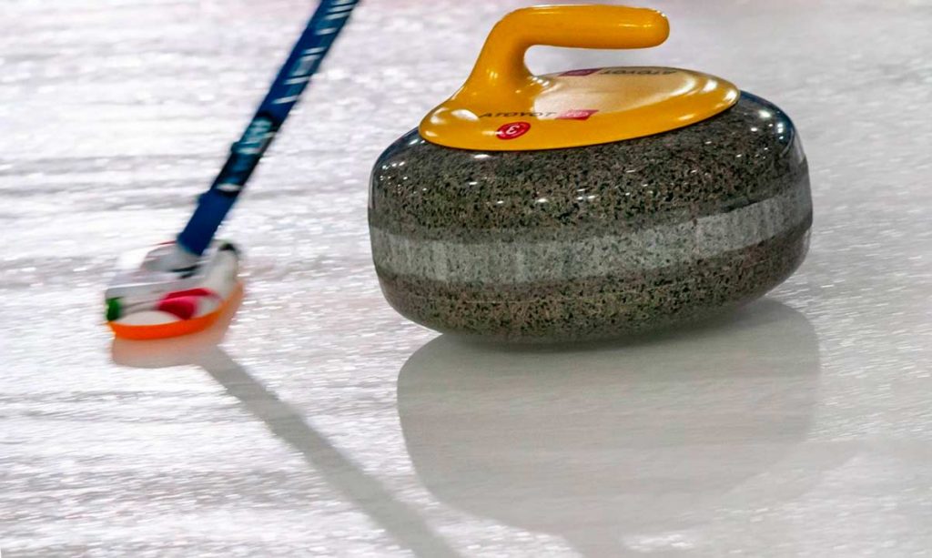 Curling stones in movement